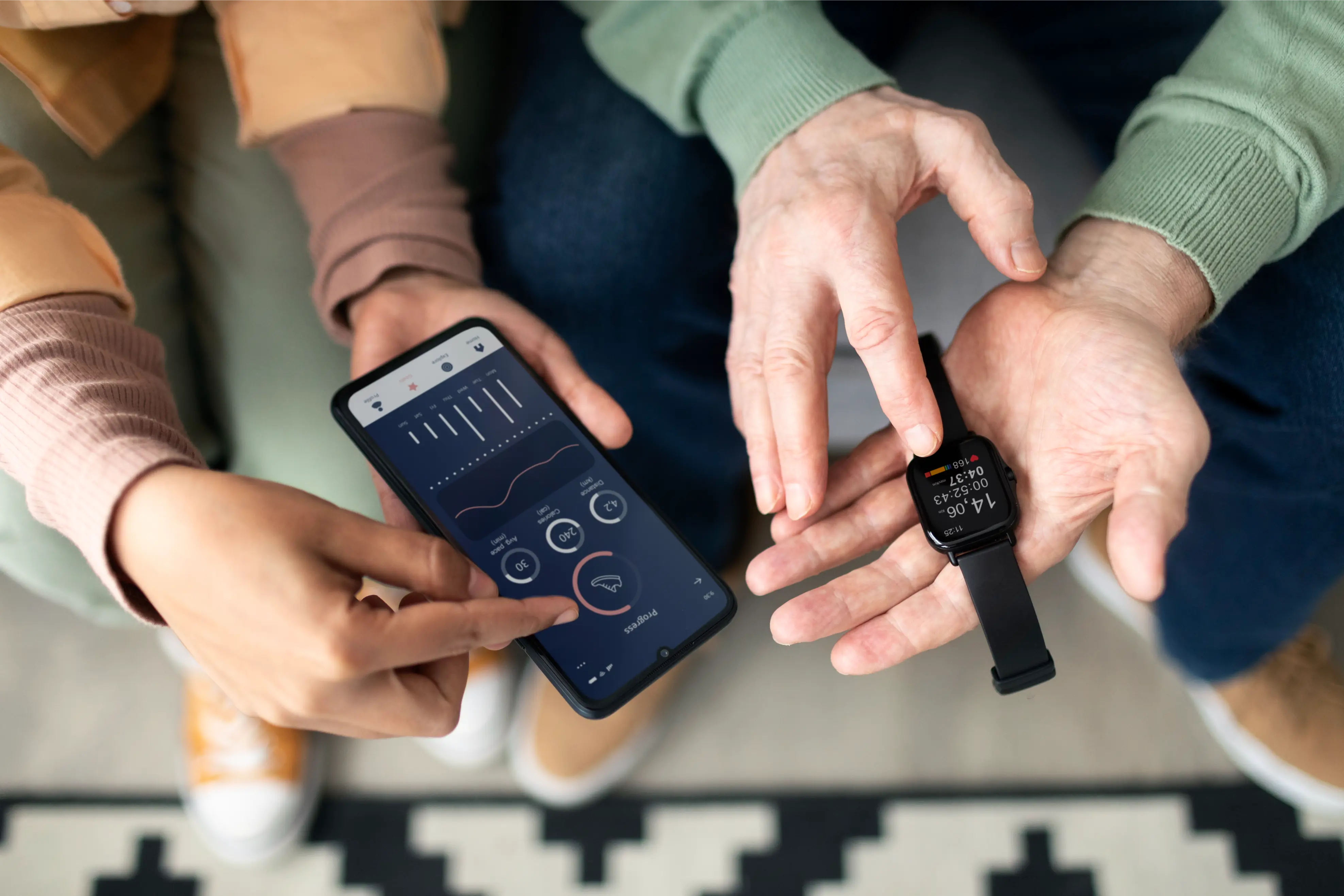Smartwatch showing workout data beside a phone companion app with activity charts